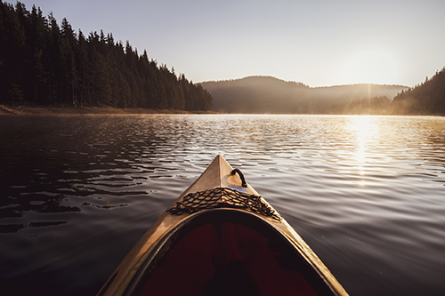 Kayaking at the sunrise light in the White Mountains.